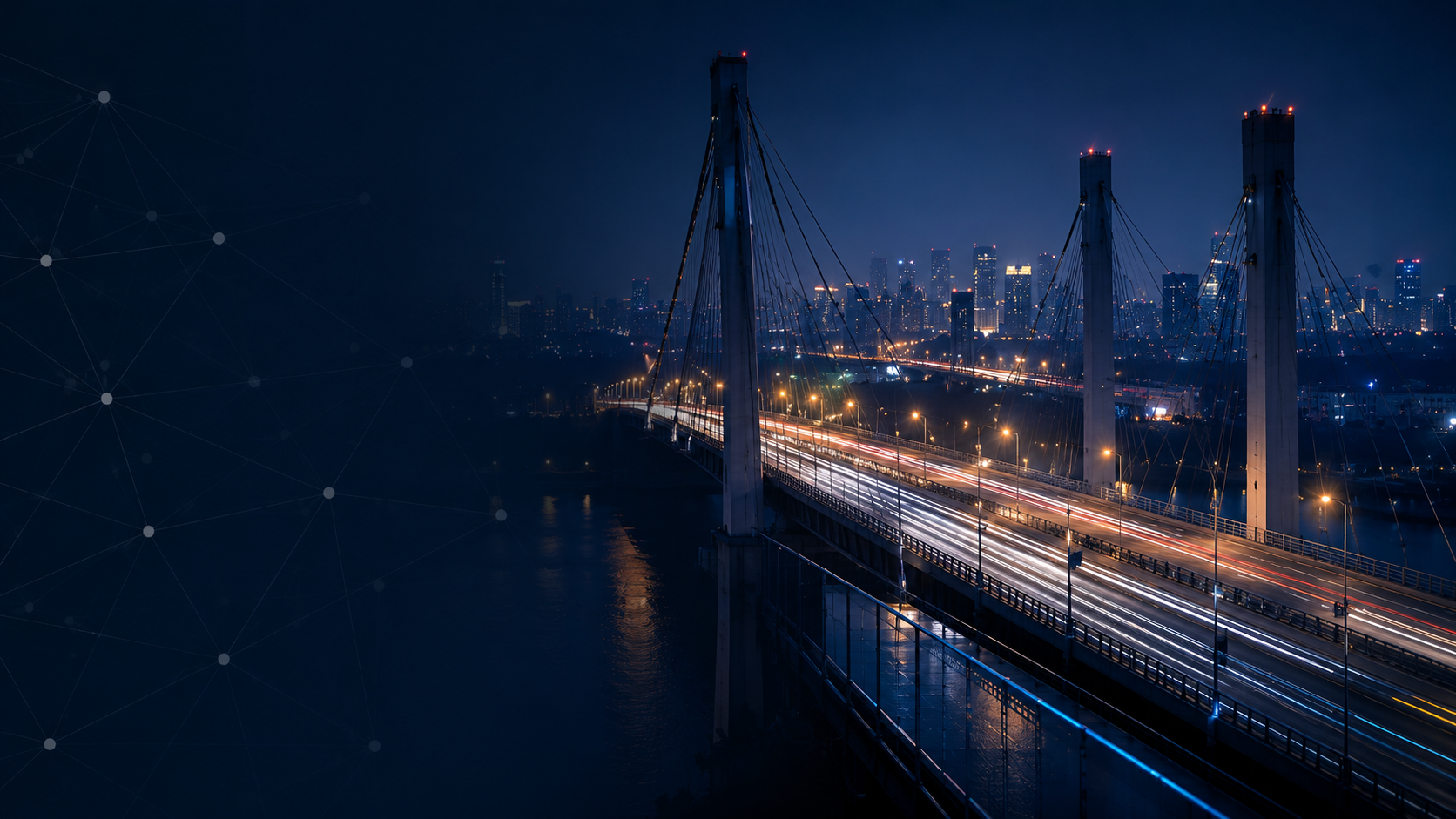 Bridge connecting a city at night